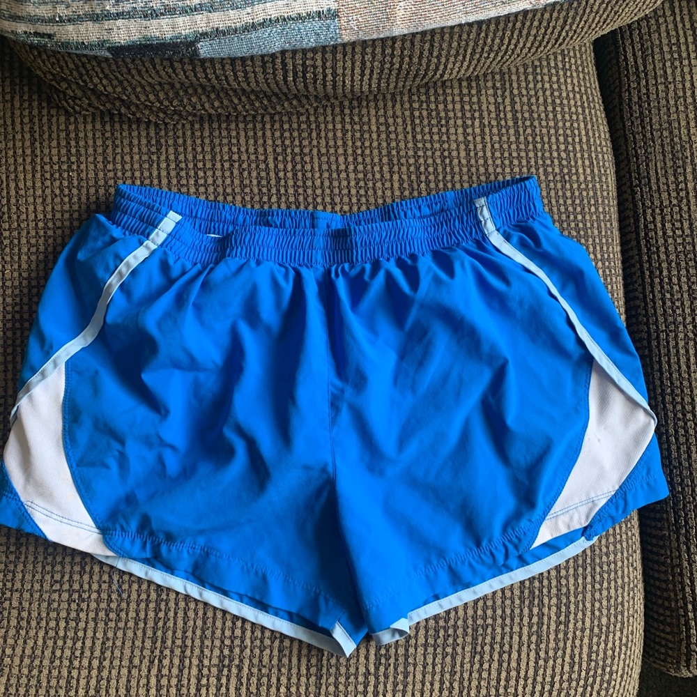 Blue Nike running shorts